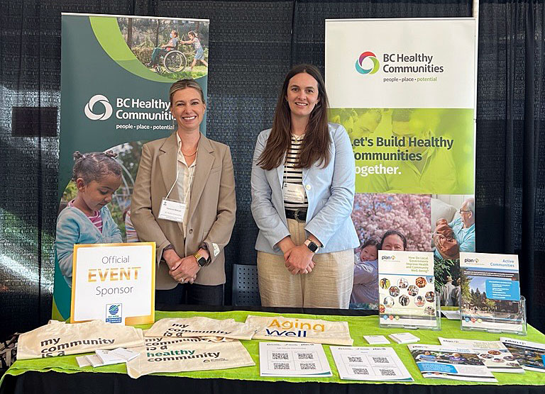 BCHC Executive Director Vanessa Manuel (left) and Age-friendly Communities Program Lead Alyssa Roehrich in the BCHC booth at the BCRPA event last week.