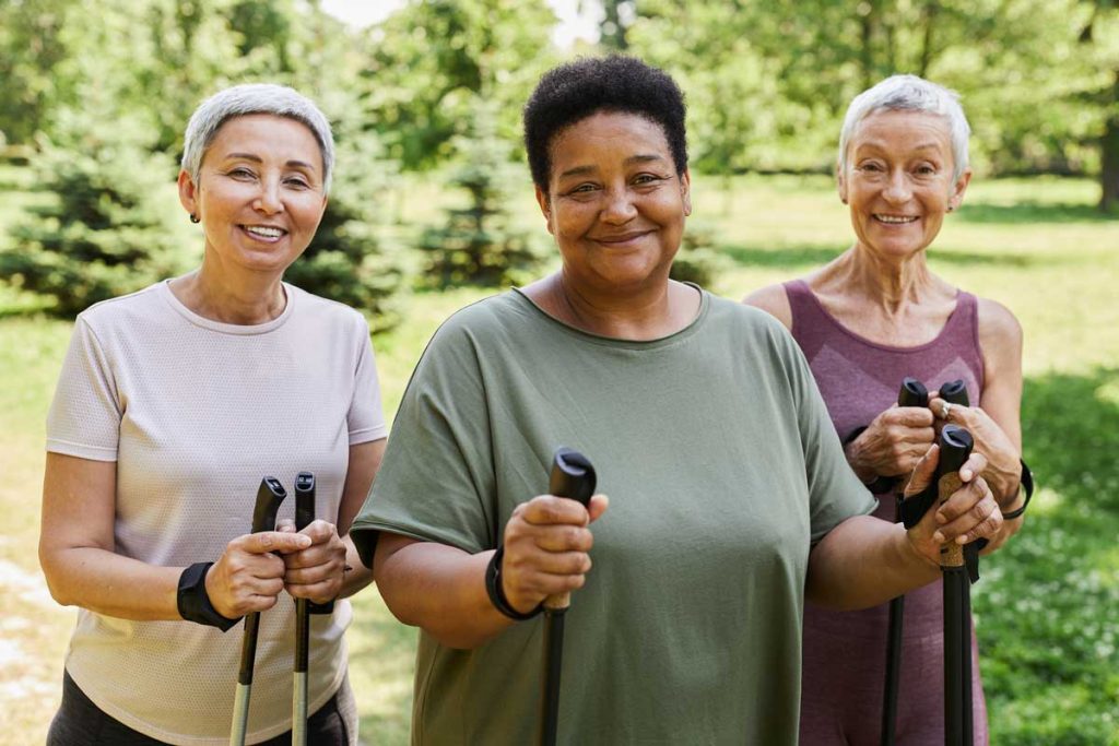 Three older adults out hiking