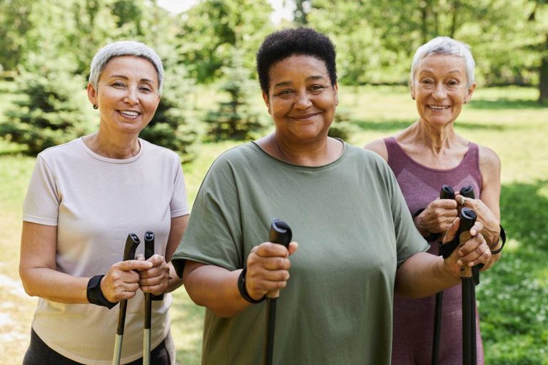 Three older adults out hiking