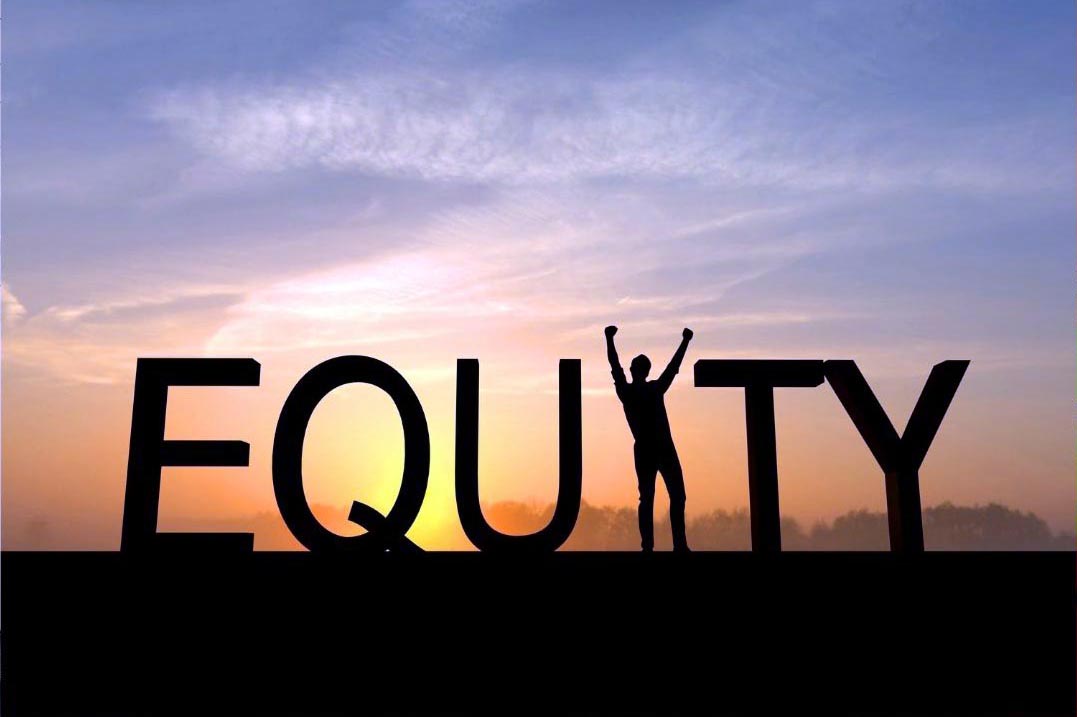 The word EQUITY in silhouette against a sunrise, with a person standing in place of the letter I, arms raised